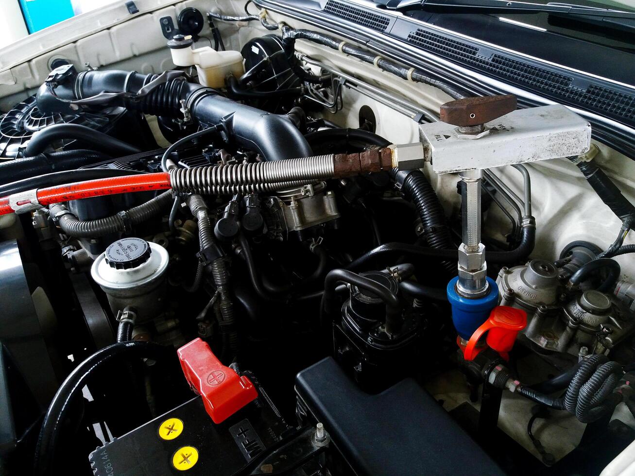 Bangkok, Thailand - May 1, 2024 Close up car engine fill LPG or Liquid Petroleum Gas, NGV or Natural Gas for Vehicles at gas station. Fuel and energy of car for travel and Transportation. photo
