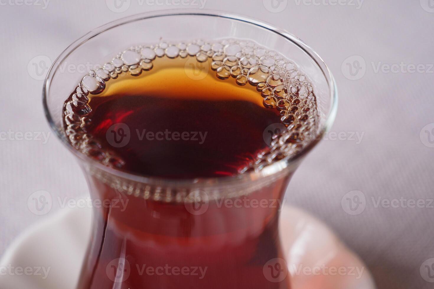 Traditional turkish tea on white table . photo