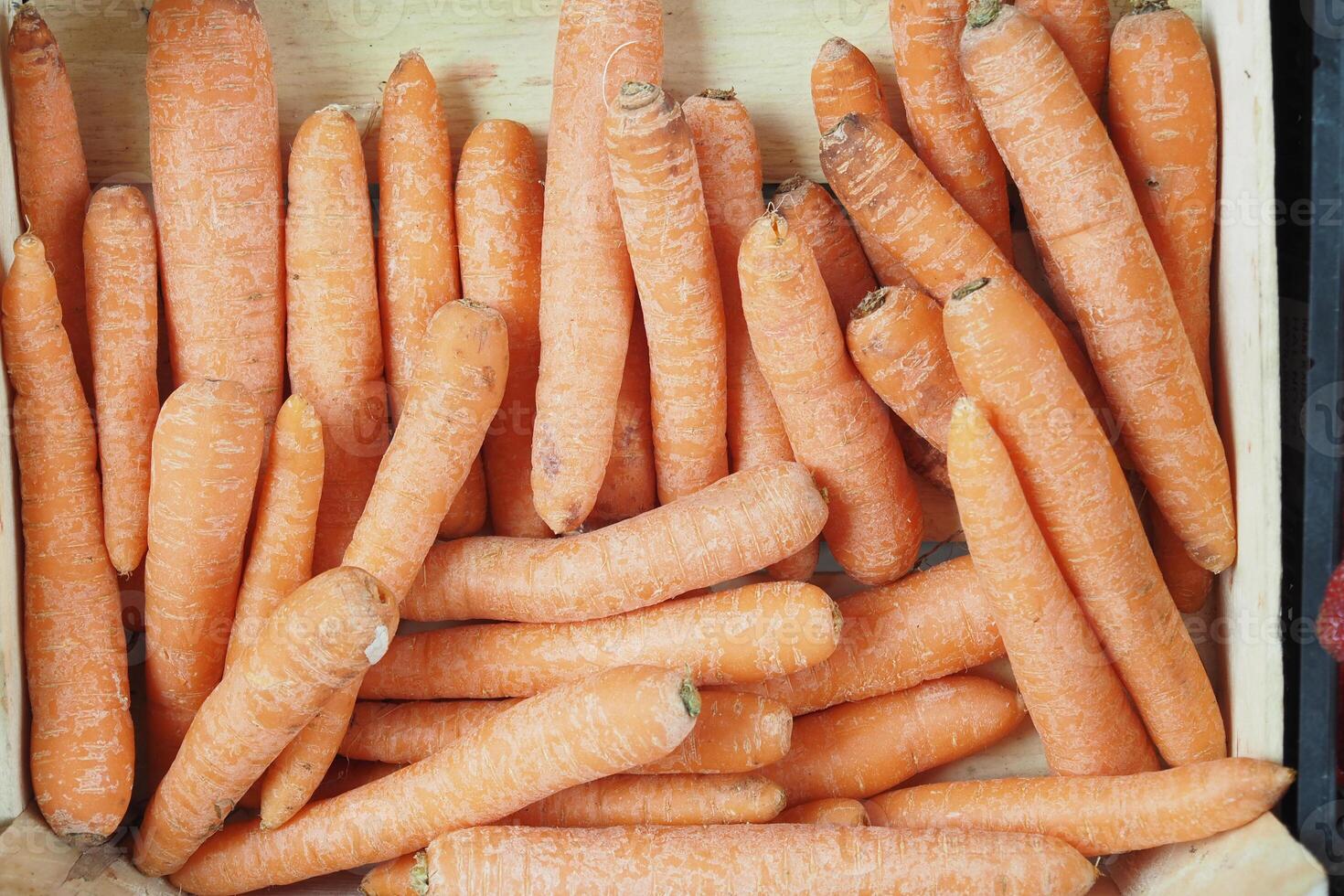 pile carrot displaying at local shop. photo
