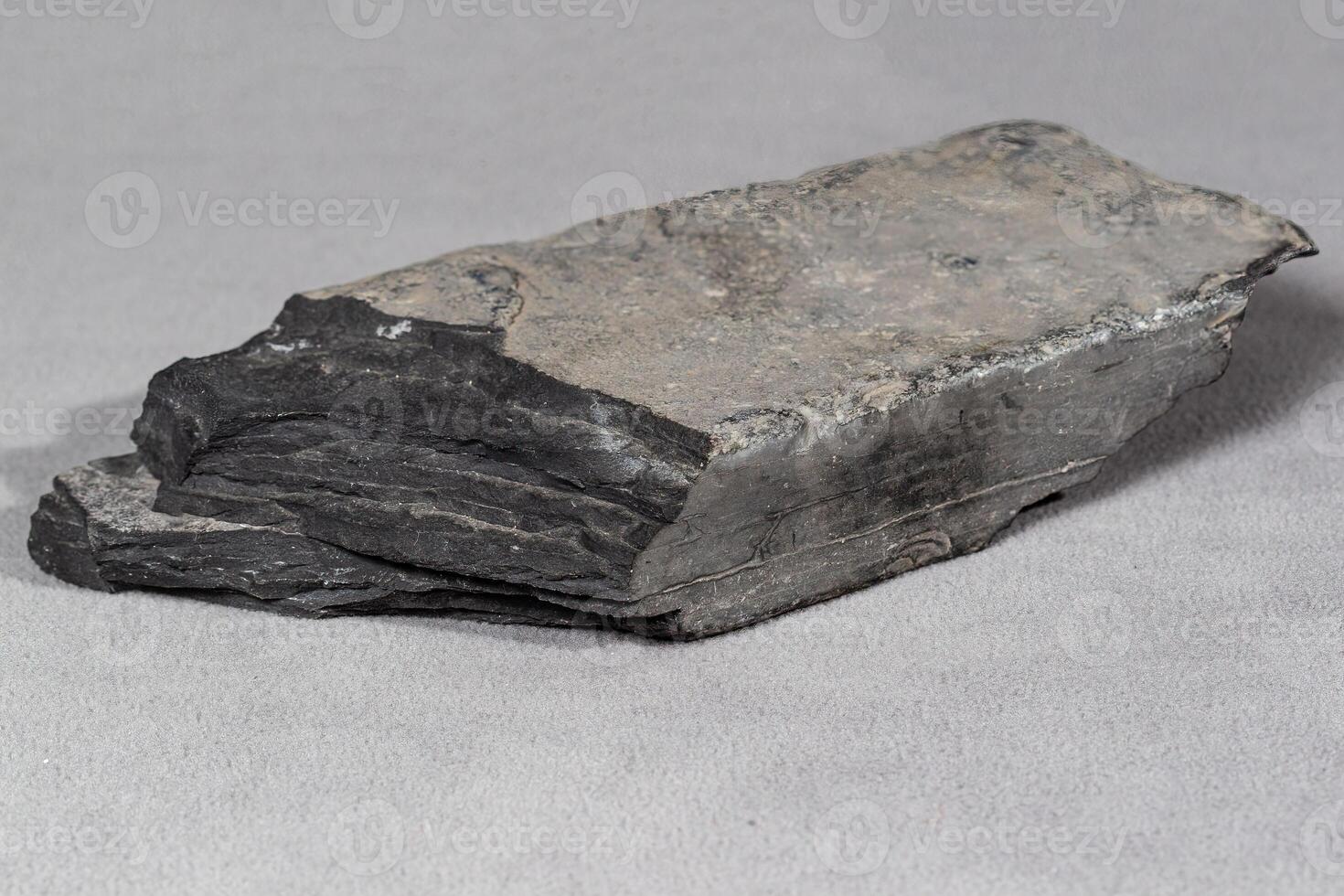 the bottom of gray flat brick shaped rock found many years ago photo