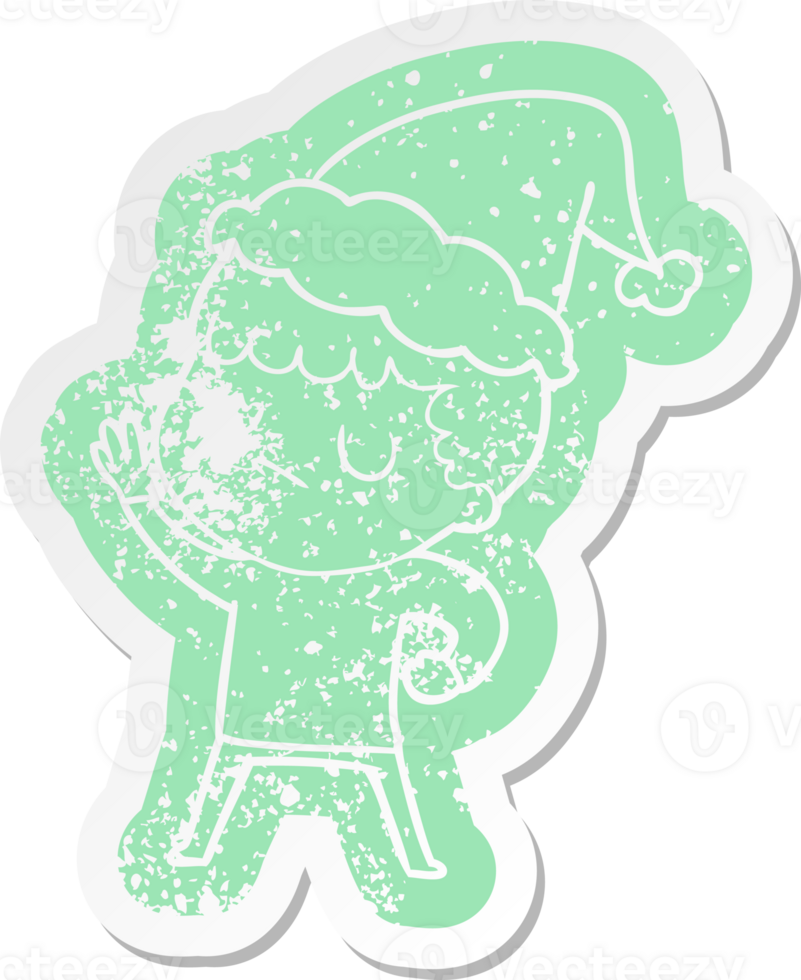 quirky cartoon distressed sticker of a grumpy boy wearing santa hat png