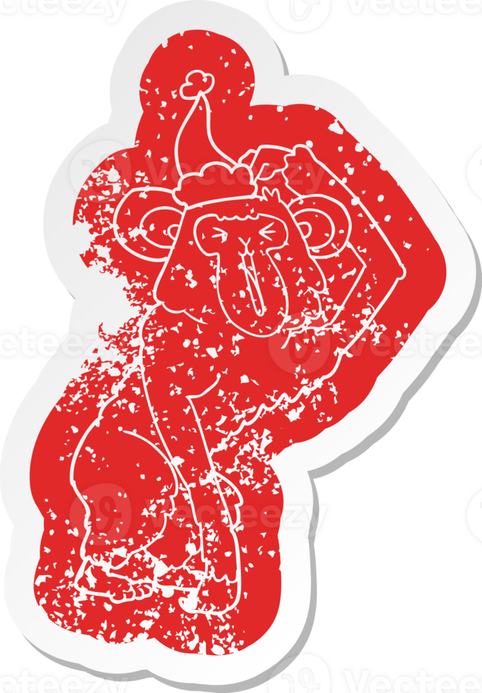 quirky cartoon distressed sticker of a chimp scratching head wearing santa hat png