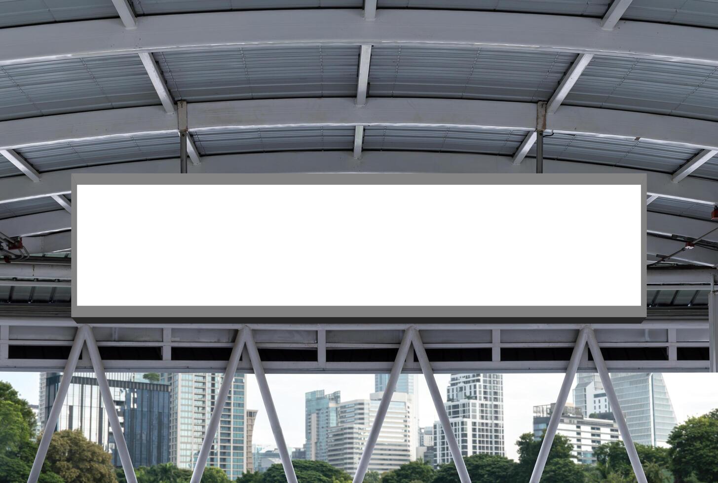 Mock up hanging white rectangle billboard at footbridge with cityscape background photo