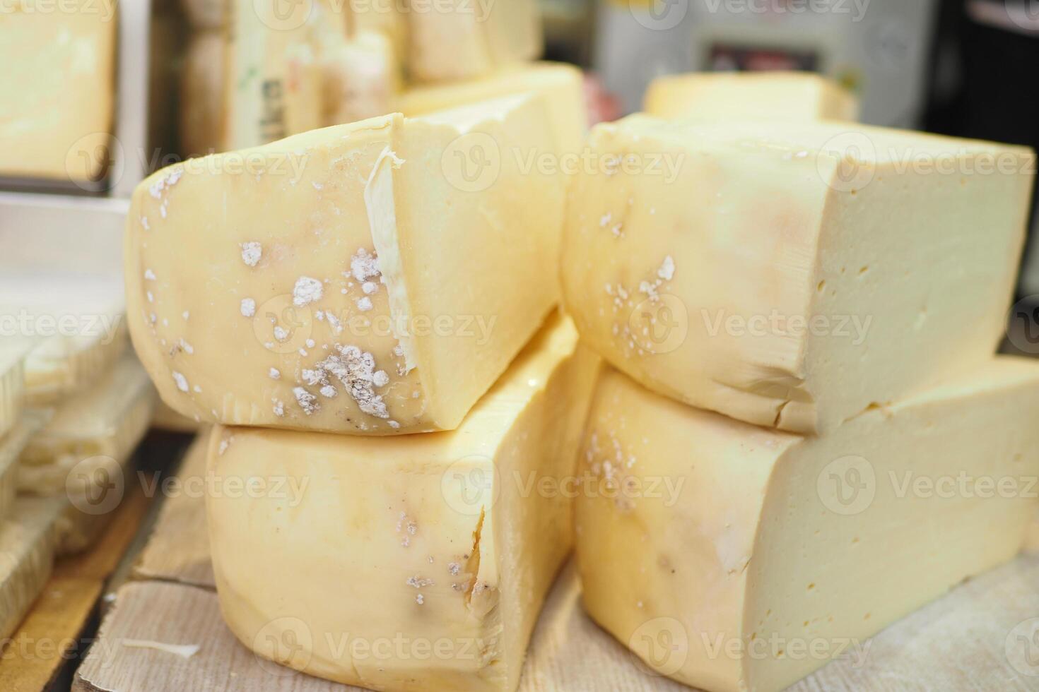 many type of cheeses on shop window photo