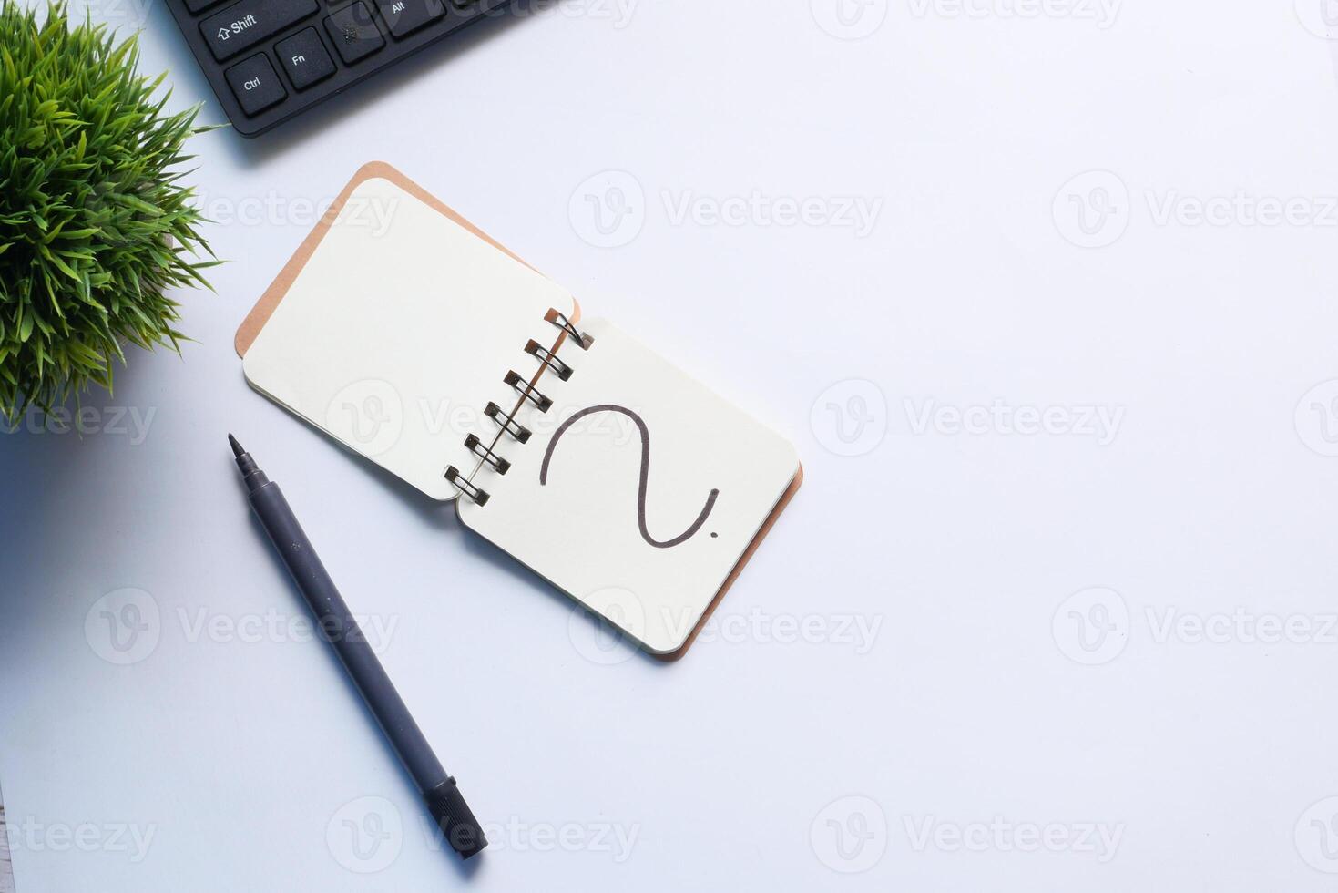 high angle view of question mark on notepad photo