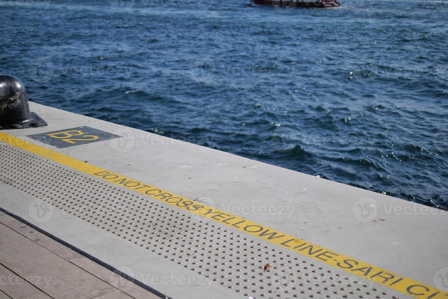 yellow caution sign or line on the platform photo