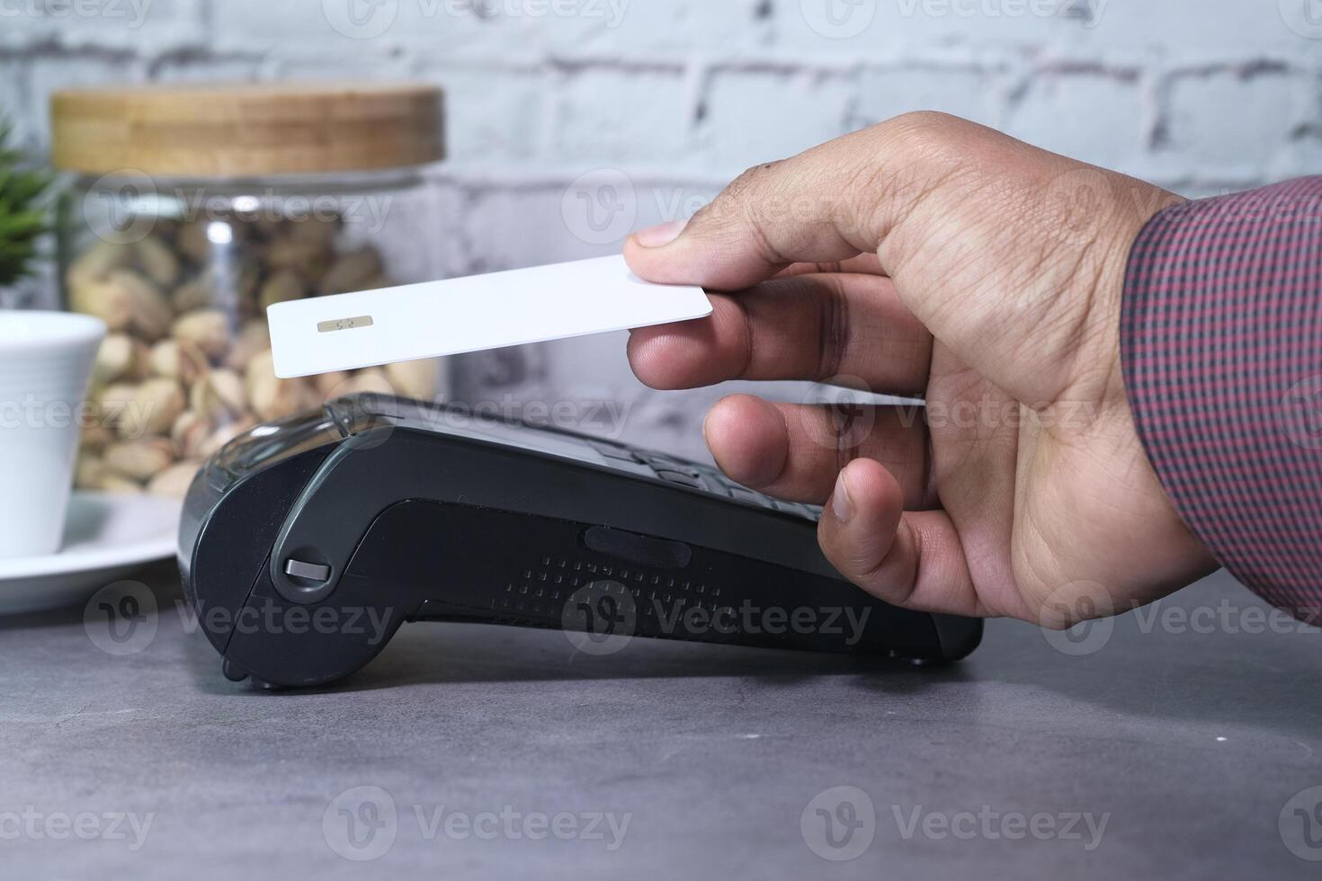 Payment terminal charging from a card, contactless payment. photo