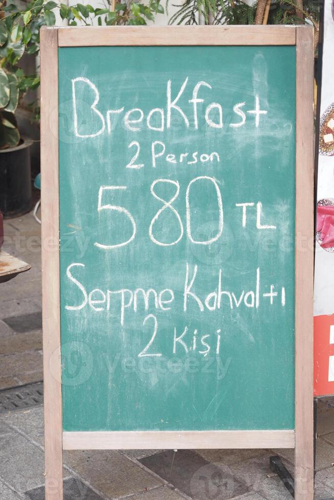 Cafe menu on black board outdoor photo