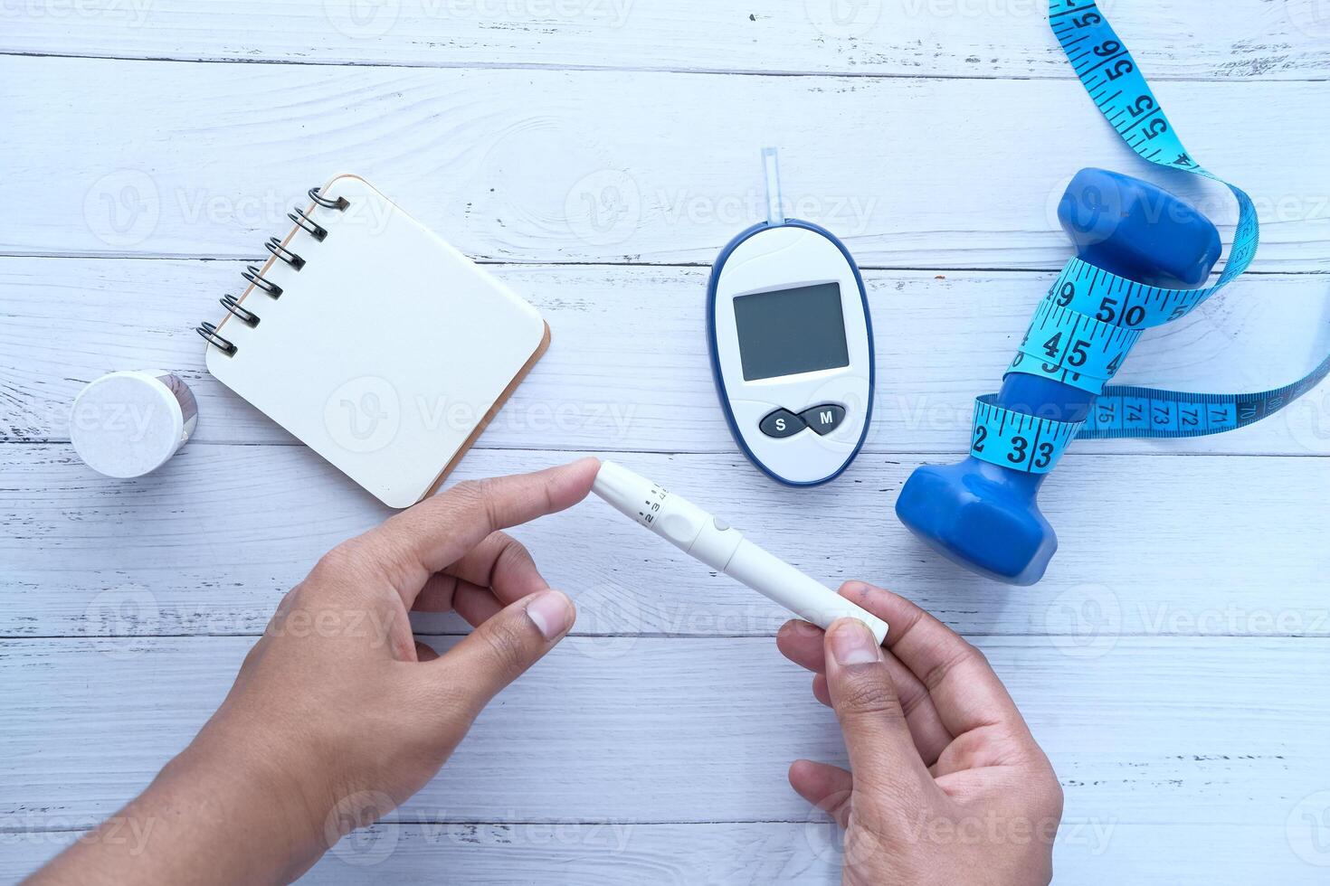 man checking blood sugar level, Top view photo