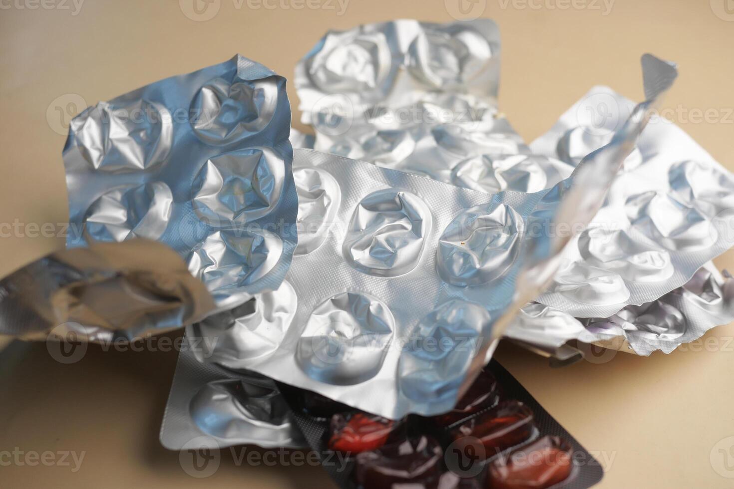 Close up of empty pills of blister pack on table photo