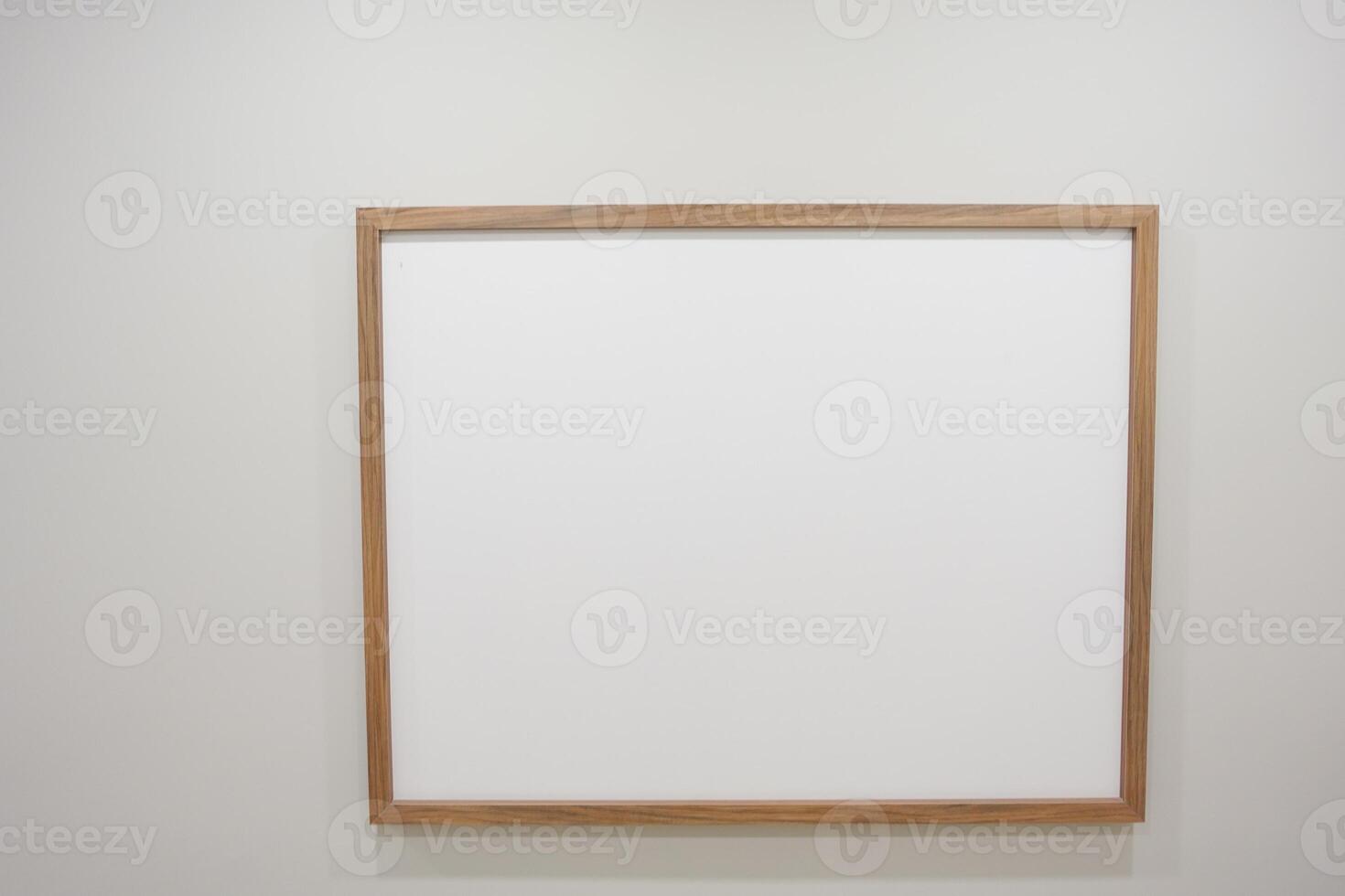 empty photo frame on white wall