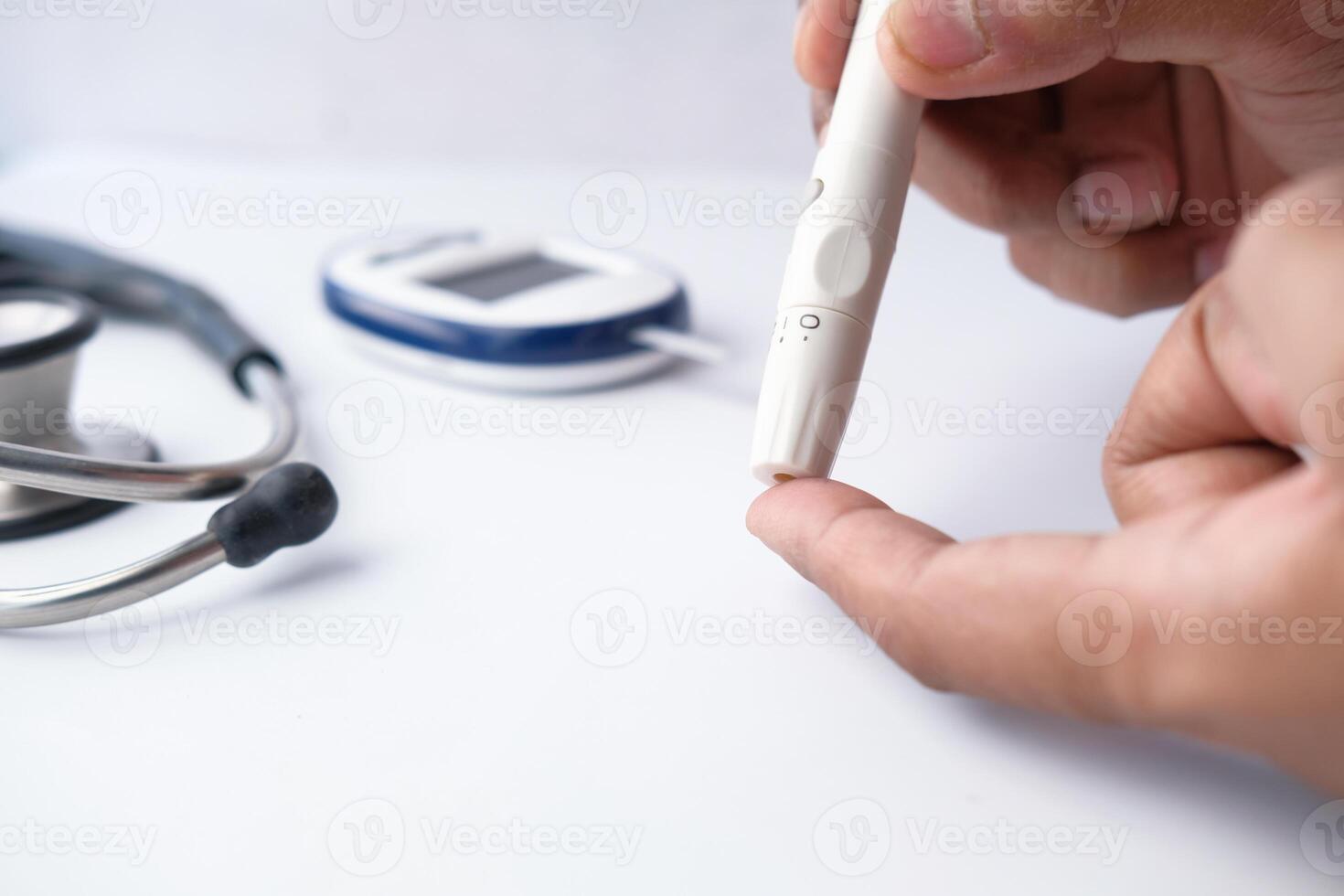 man checking blood sugar level, photo