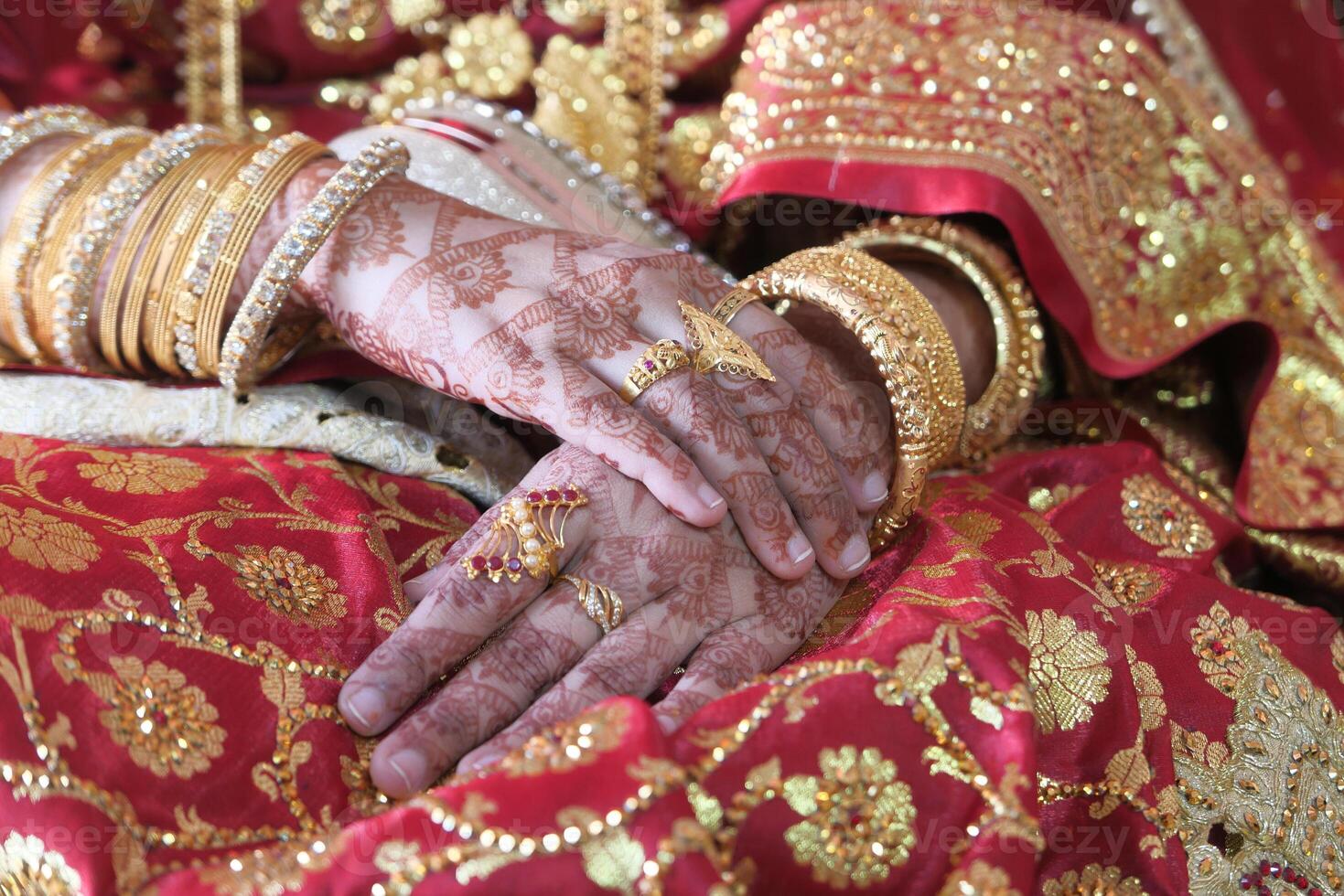 Close up of indian bride hand with jewelry photo
