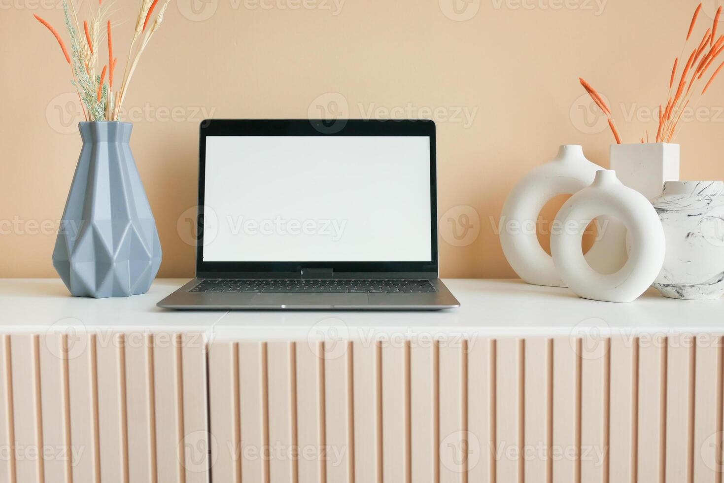 laptop with blank screen on office desk. photo