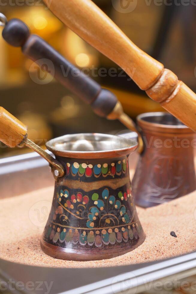 top view of making traditional turkish coffee on sand photo