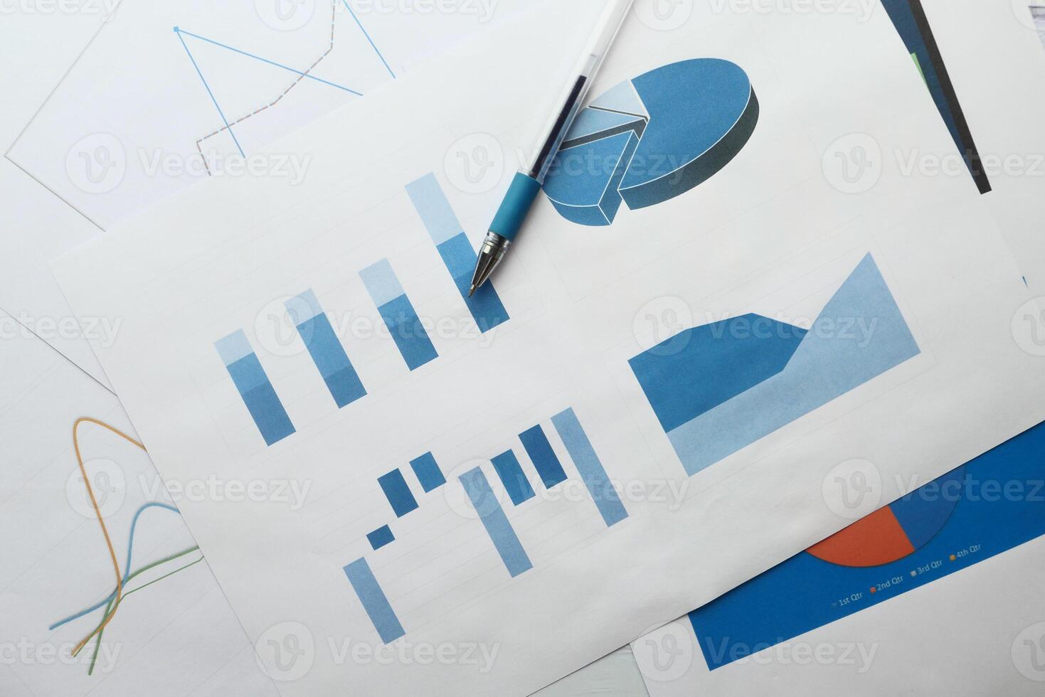 close up of bar chart and pencil on paper photo