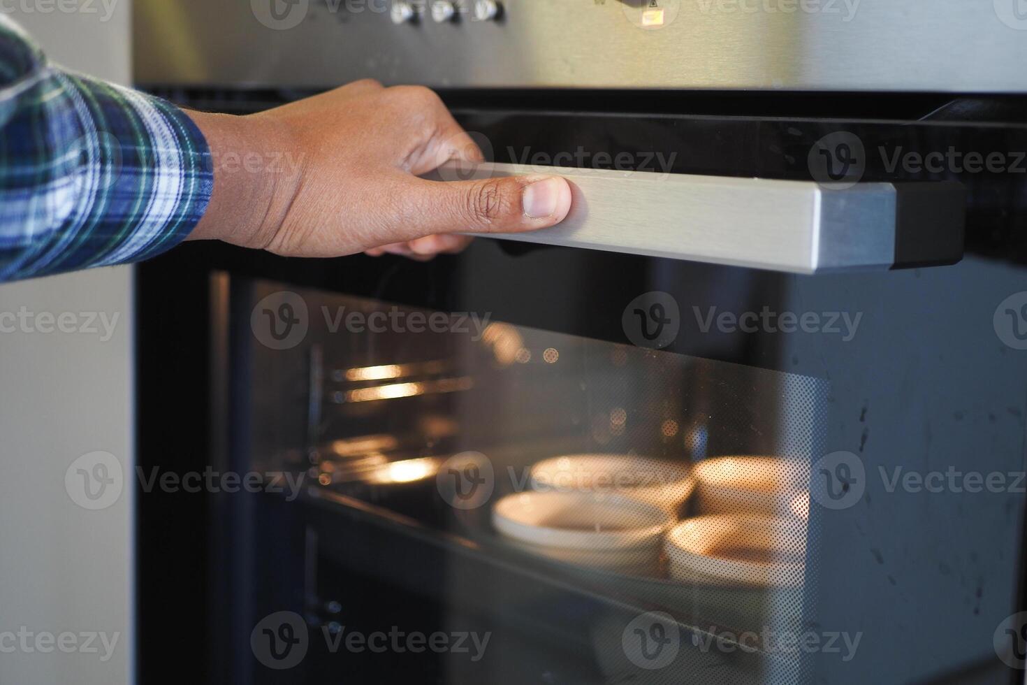 cooking brown cupcakes. Baking in oven. photo