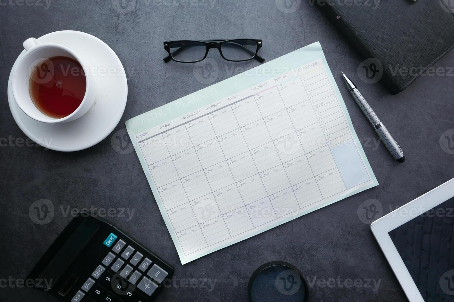 high angle view of weekly planner on table. photo