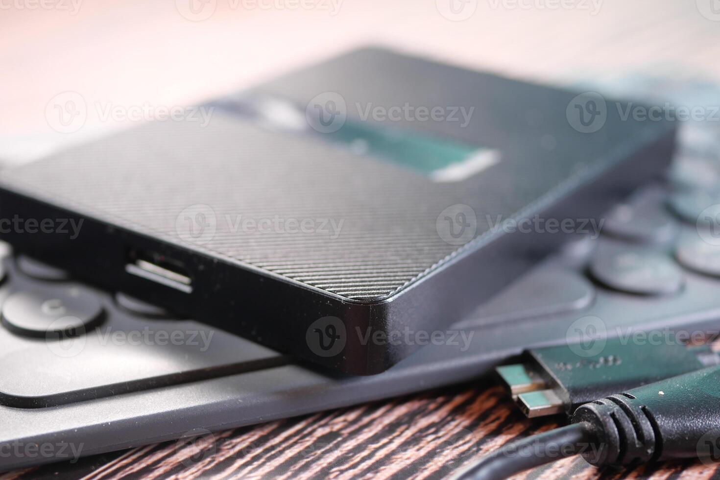 external hard drives on a keyboard on table photo