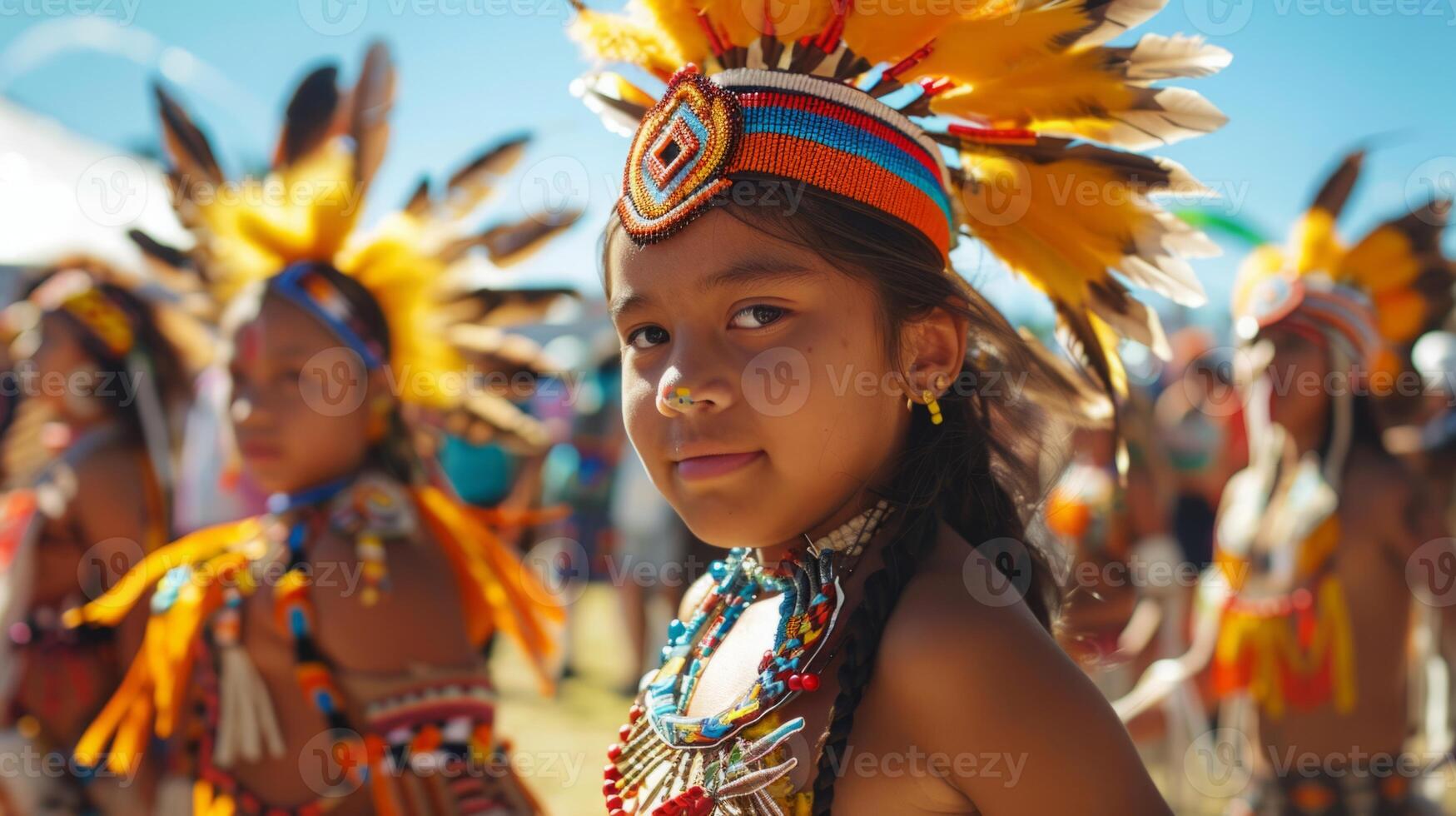 Young children wearing traditional Native American clothing gathered together. photo