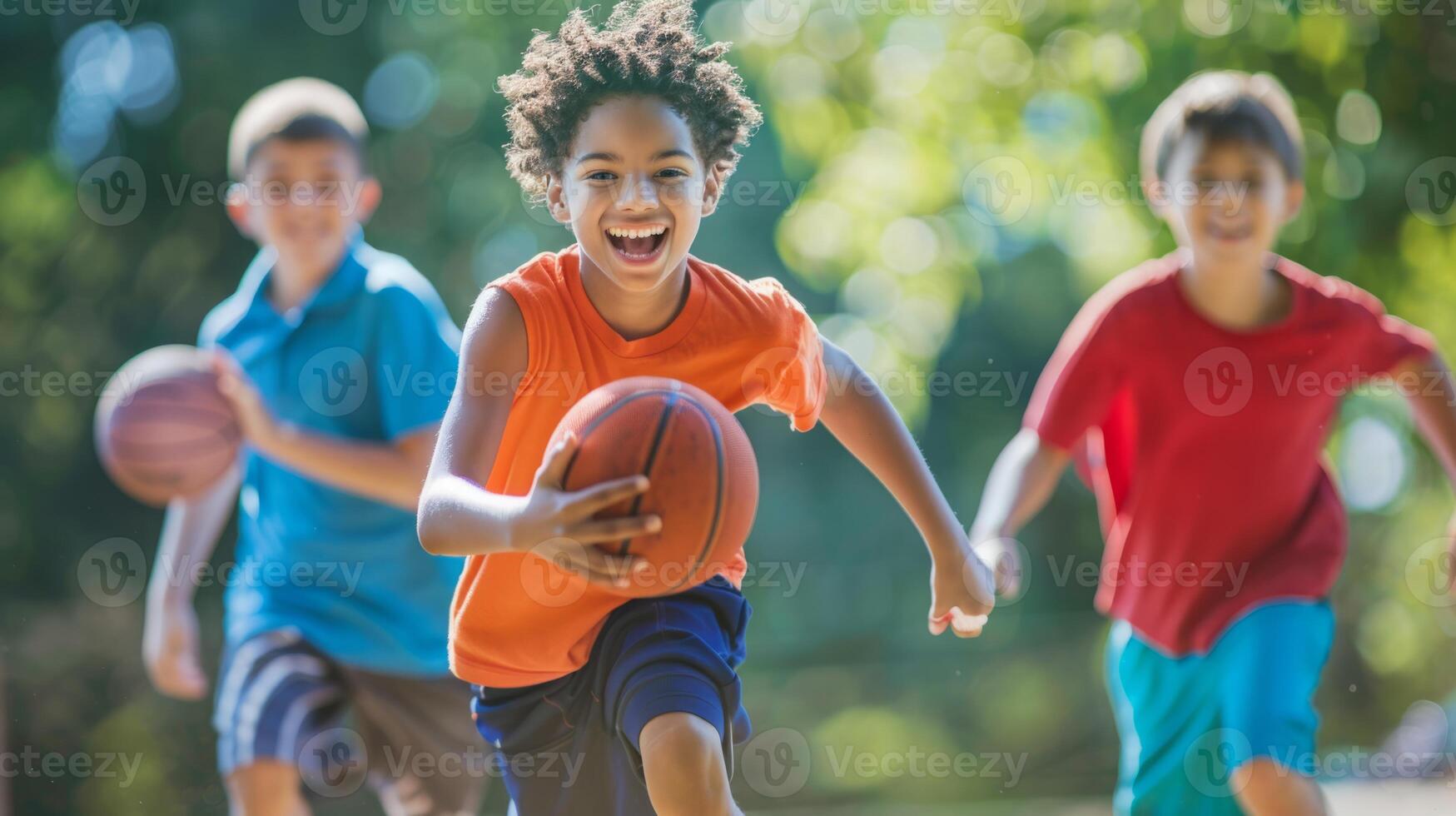 A group of children playing basketball on a court in a park, dribbling, passing, and shooting hoops. photo