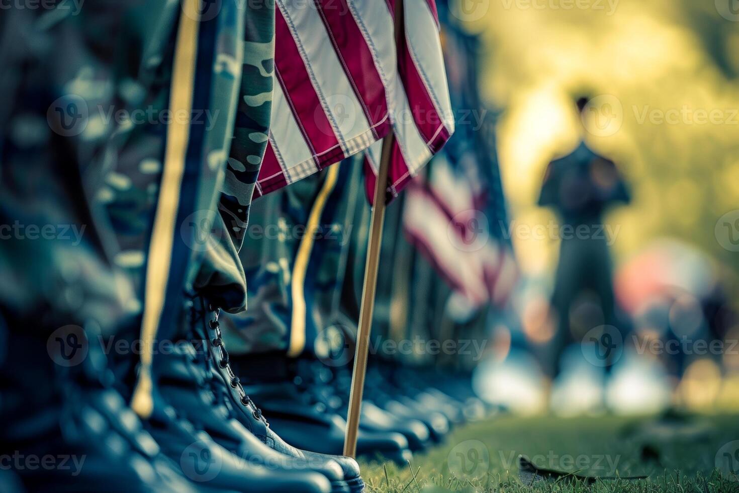 Row of soldiers in camouflage uniforms with American flags standing at attention during military ceremony or Veterans Day event. Concept of patriotism, service, honor and sacrifice photo
