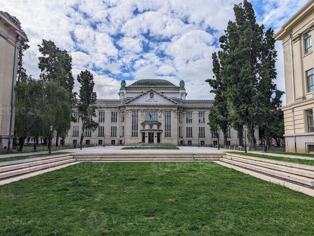Old beautiful buildings and architecture surrounding green park in Zagreb city, Croatia, Hrvatska photo