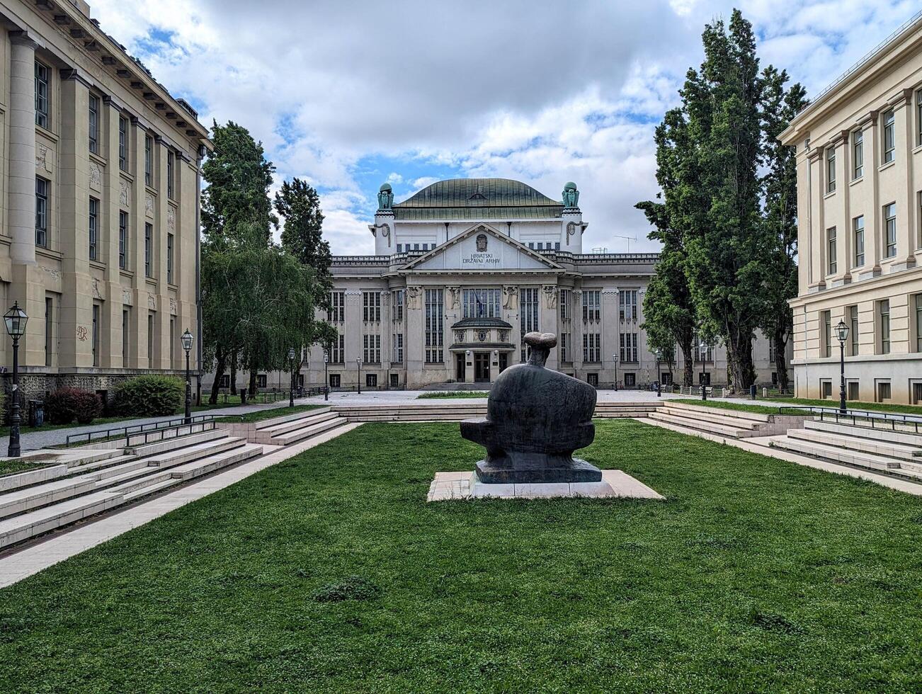 Old beautiful buildings and architecture surrounding green park in Zagreb city, Croatia, Hrvatska photo