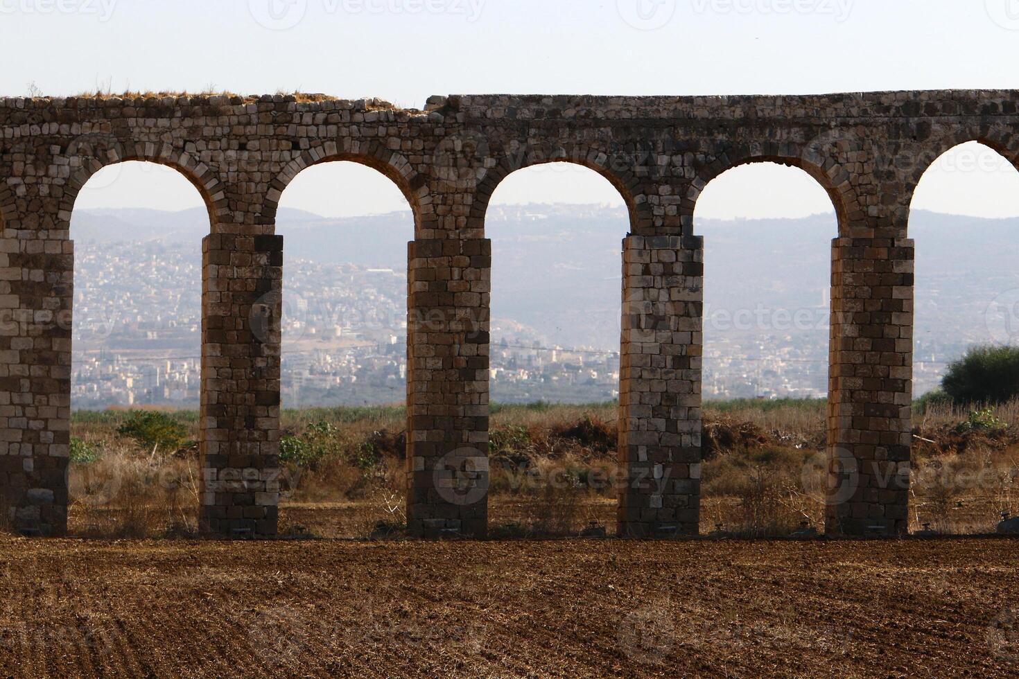 An ancient aqueduct for supplying water to populated areas. photo