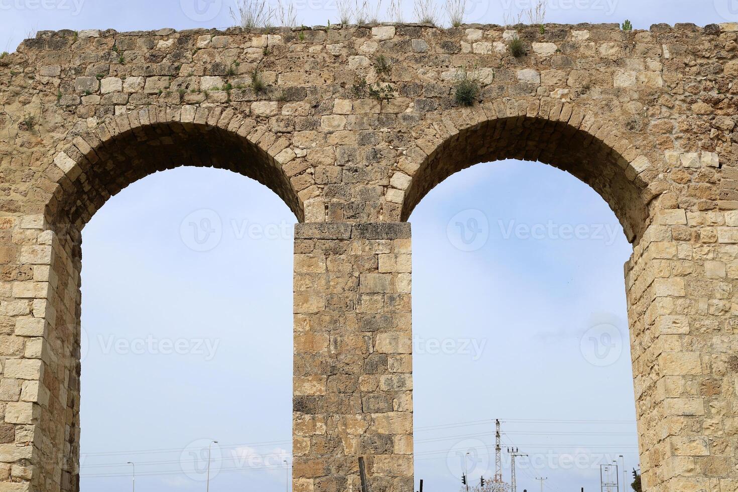 An ancient aqueduct for supplying water to populated areas. photo