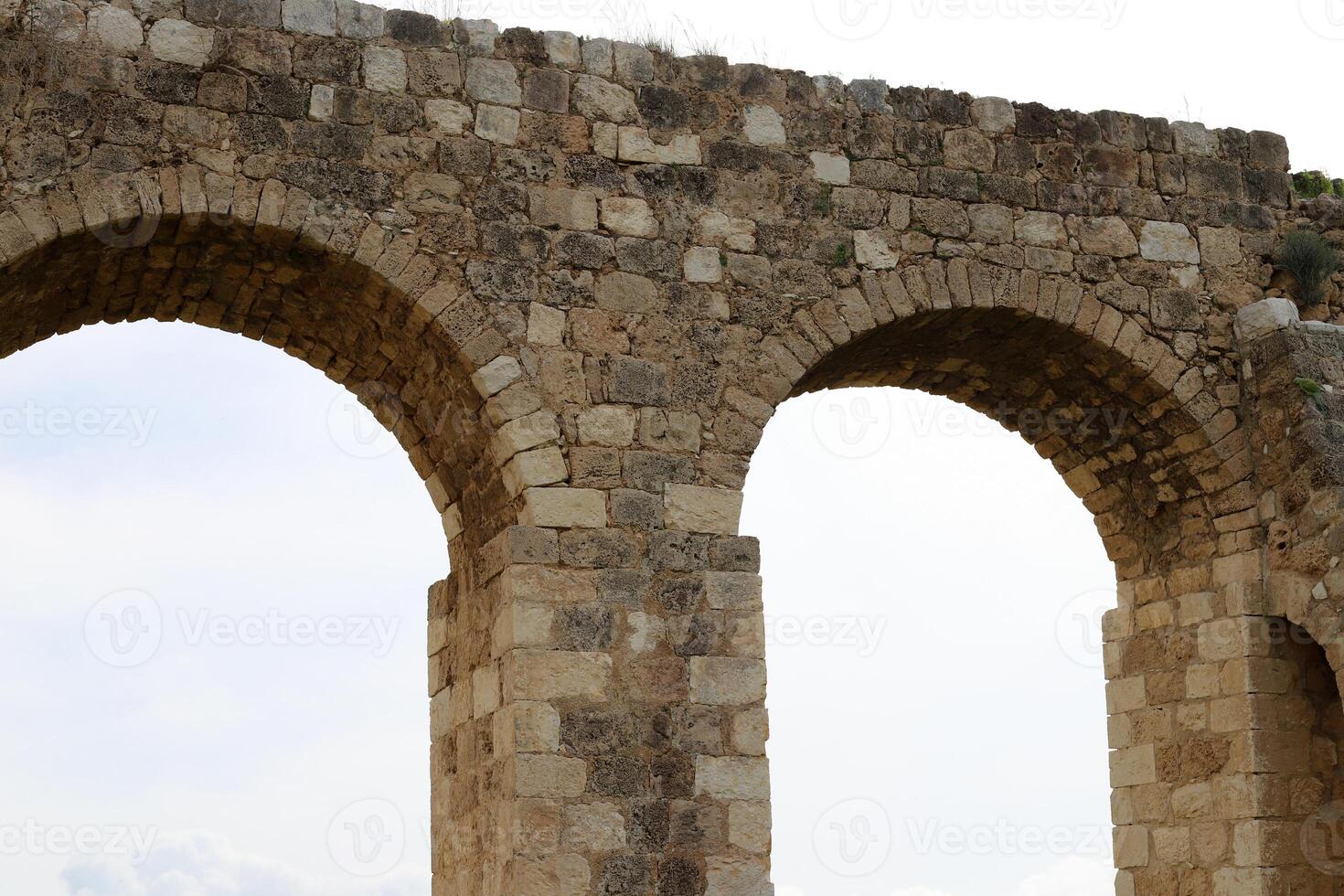 An ancient aqueduct for supplying water to populated areas. photo