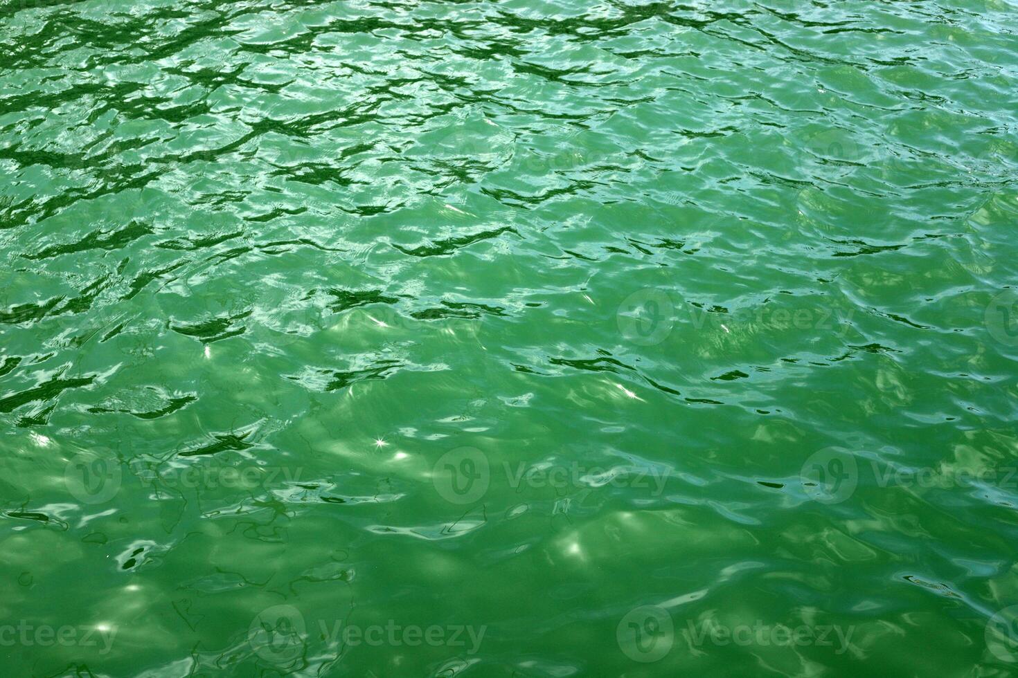 The color of water in the Mediterranean Sea in shallow water. Natural abstract background. photo