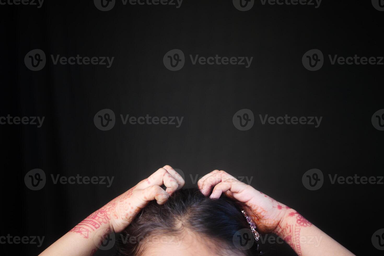 kid Scratching her Head against black background photo