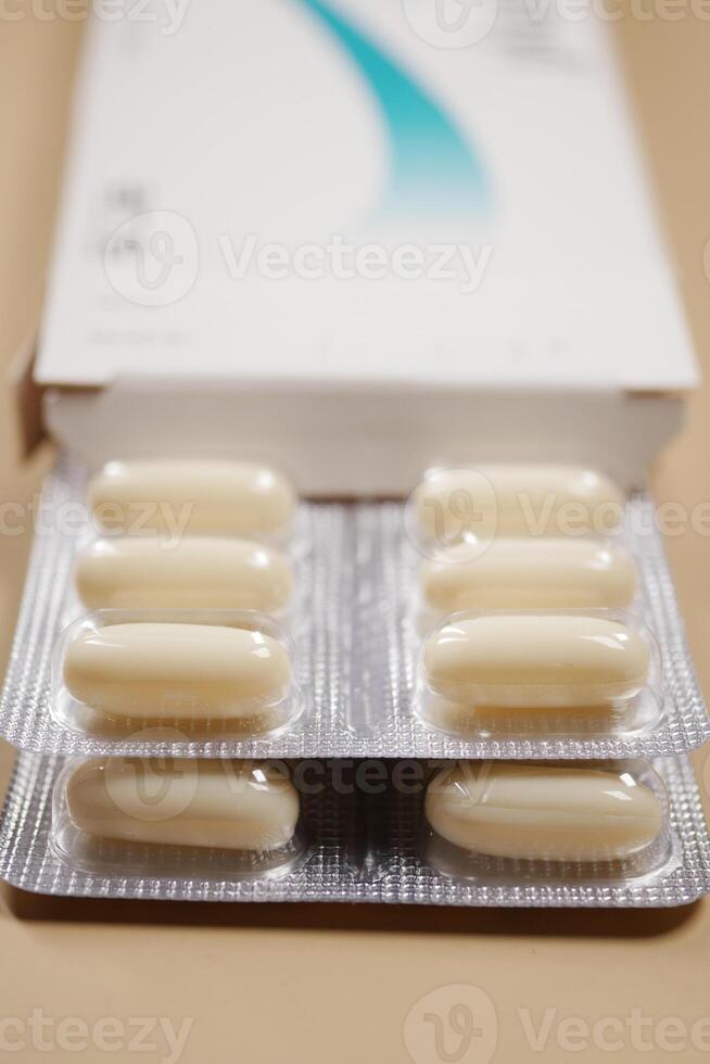 Close up of pills of blister pack on table photo