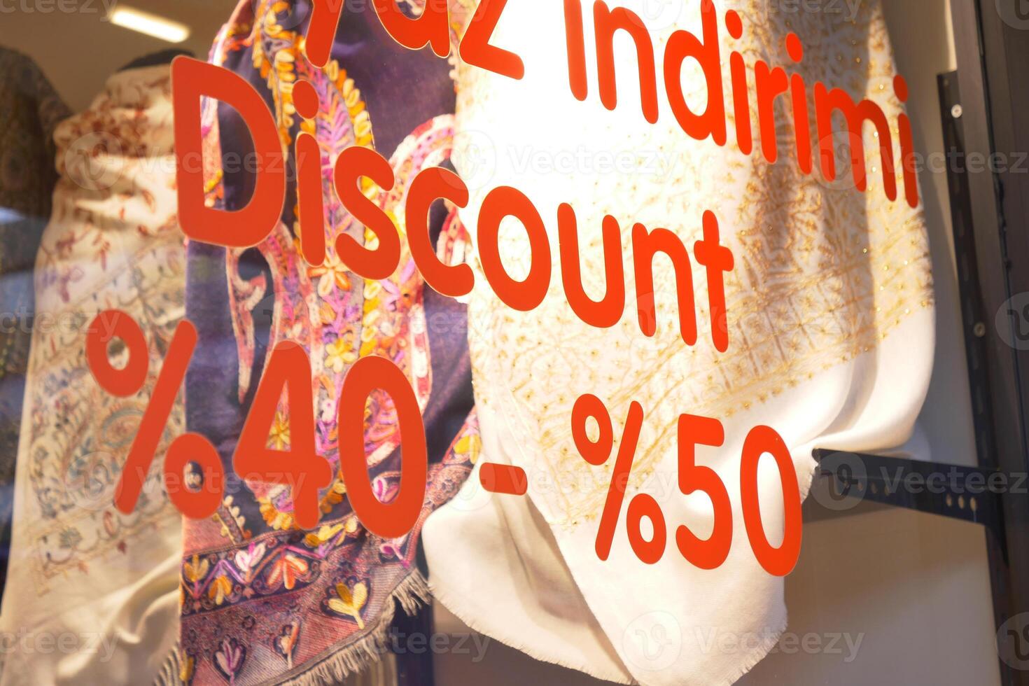 Large Sale text letters on red background on clothing store . photo