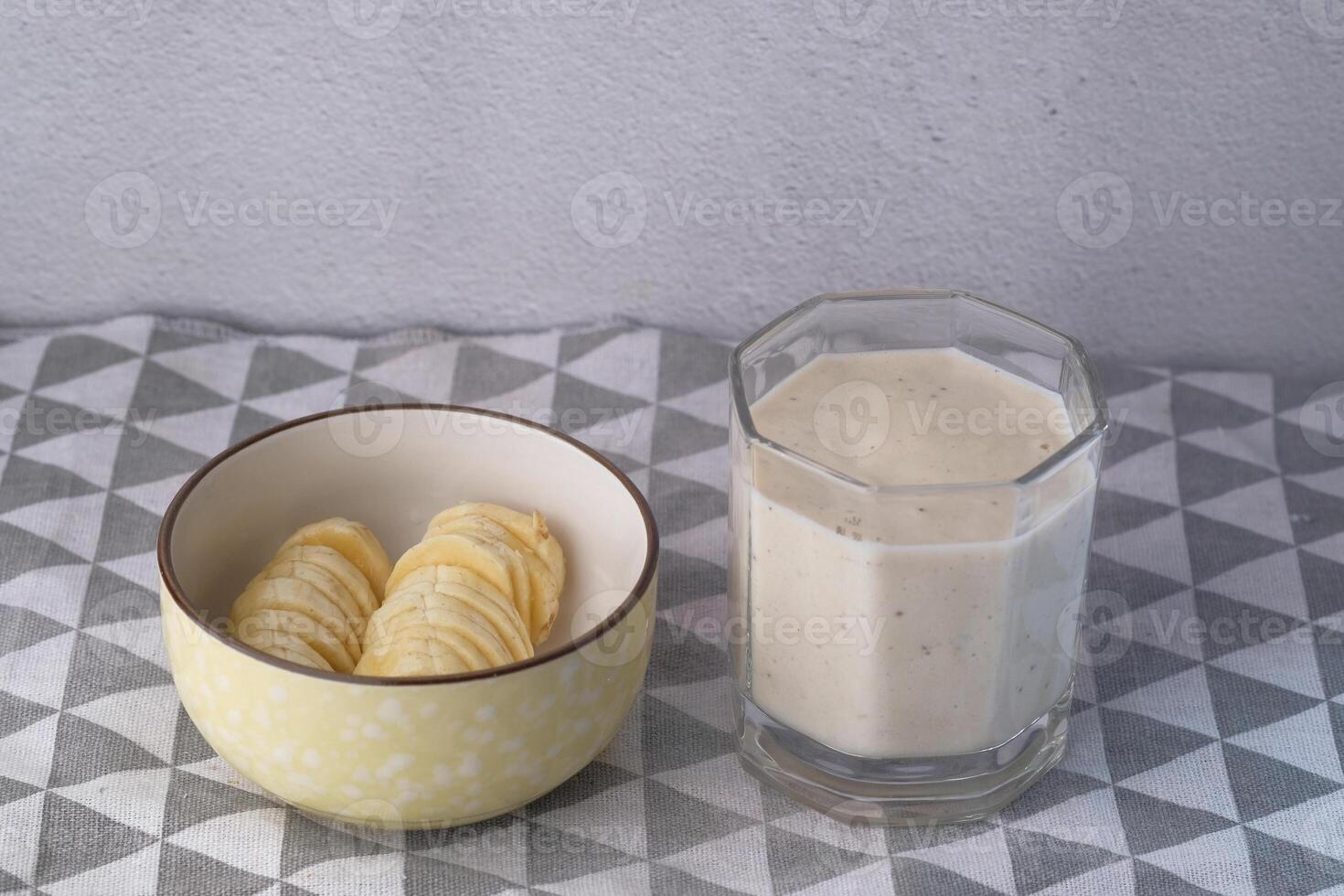 banana milkshake and banana on table, top view photo