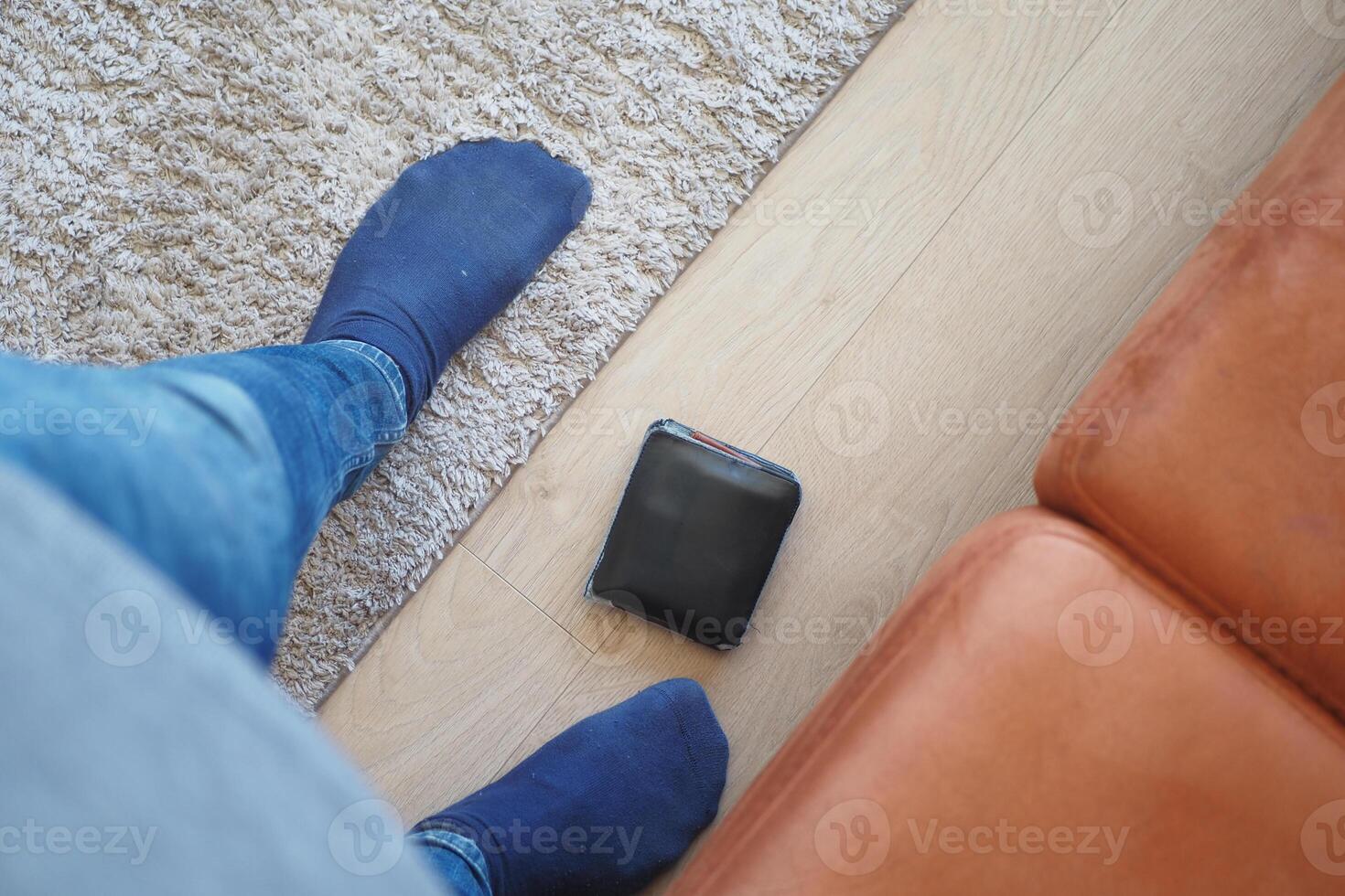 left wallet on floor at home photo