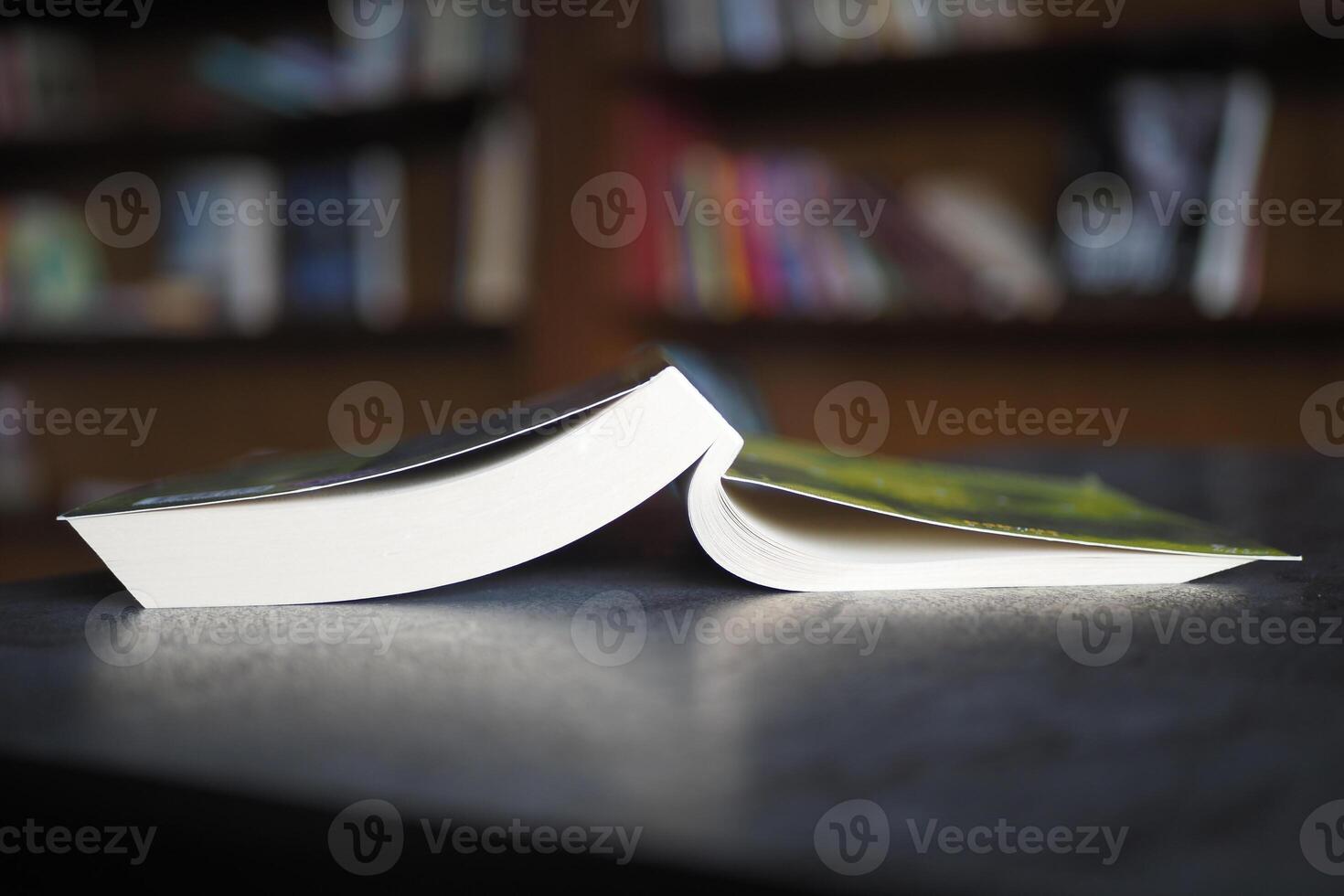 stack of books on wooden table photo
