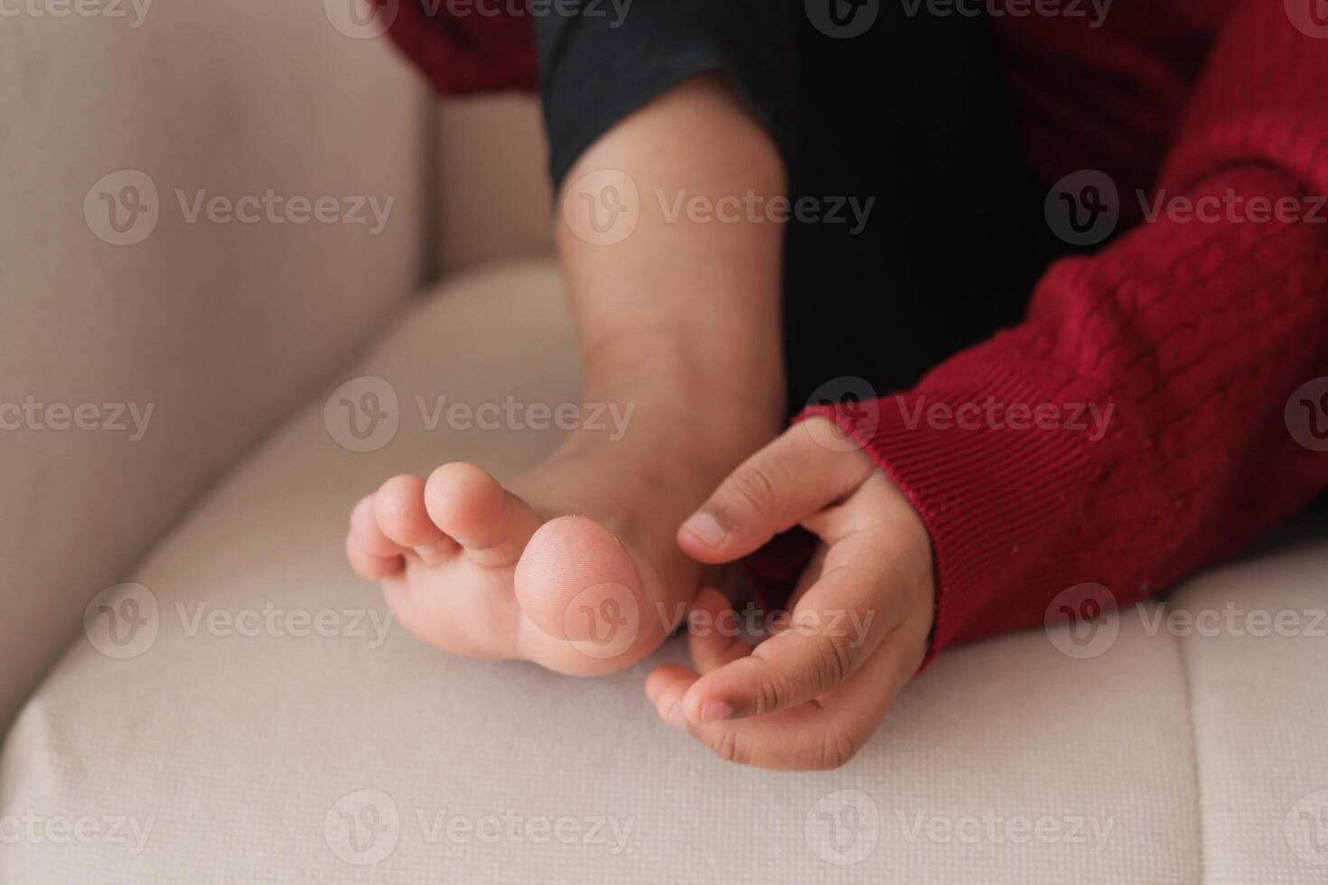 6 year old child suffering pain on feet photo