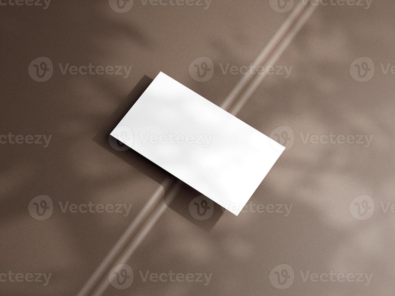 Closeup of empty white rectangle business card mockups lying diagonally on brown background. Flat lay, top view. Open composition. Blank Template for Corporate Identity. Copy space. photo