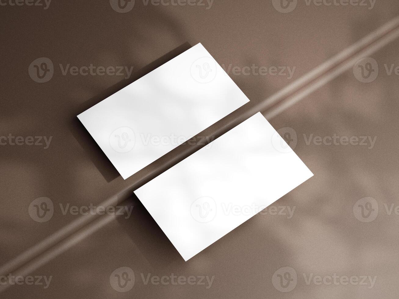 Closeup of empty white rectangle business card mockups lying diagonally on brown background. Flat lay, top view. Open composition. Blank Template for Corporate Identity. Copy space. photo