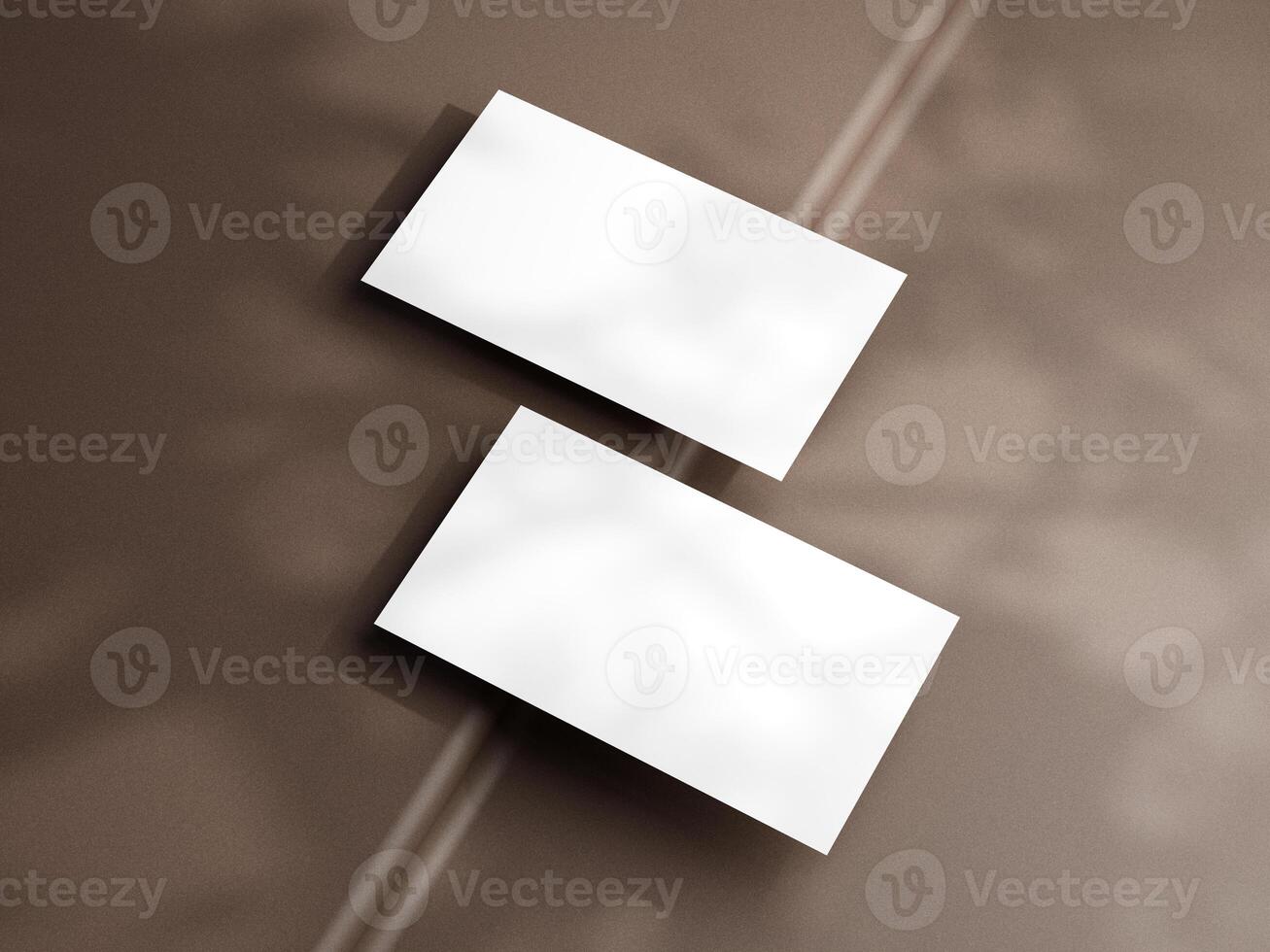 Closeup of empty white rectangle business card mockups lying diagonally on brown background. Flat lay, top view. Open composition. Blank Template for Corporate Identity. Copy space. photo