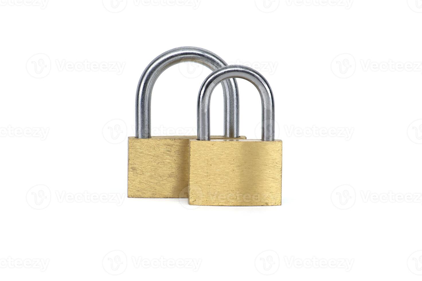 Two shiny gold padlocks isolated on white background photo