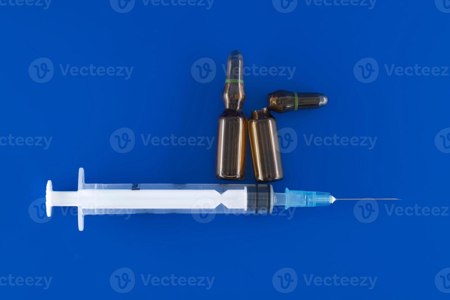 Quintessential medical tools on blue surface photo