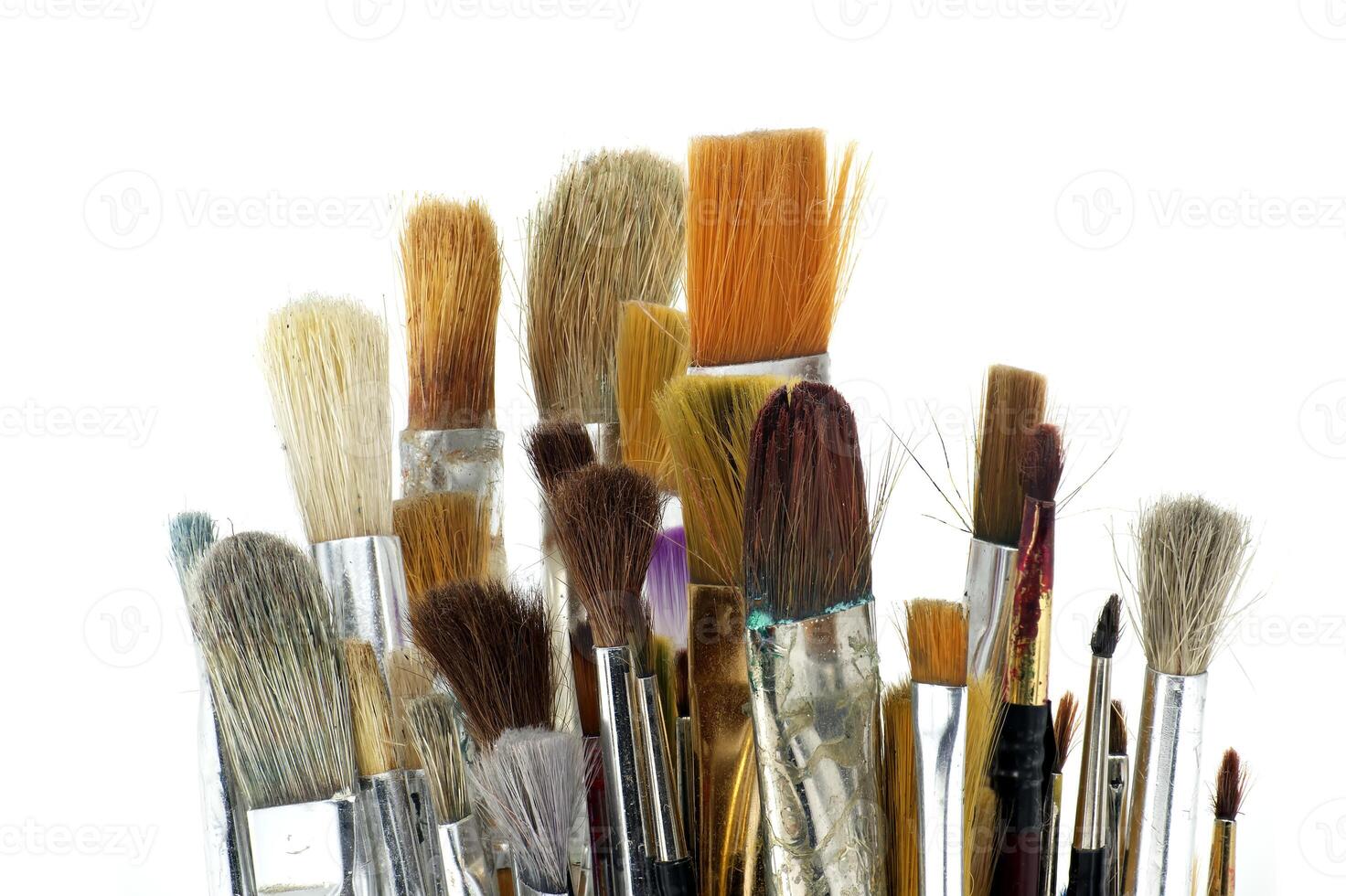 Assortment of various types and sizes of paintbrushes photo