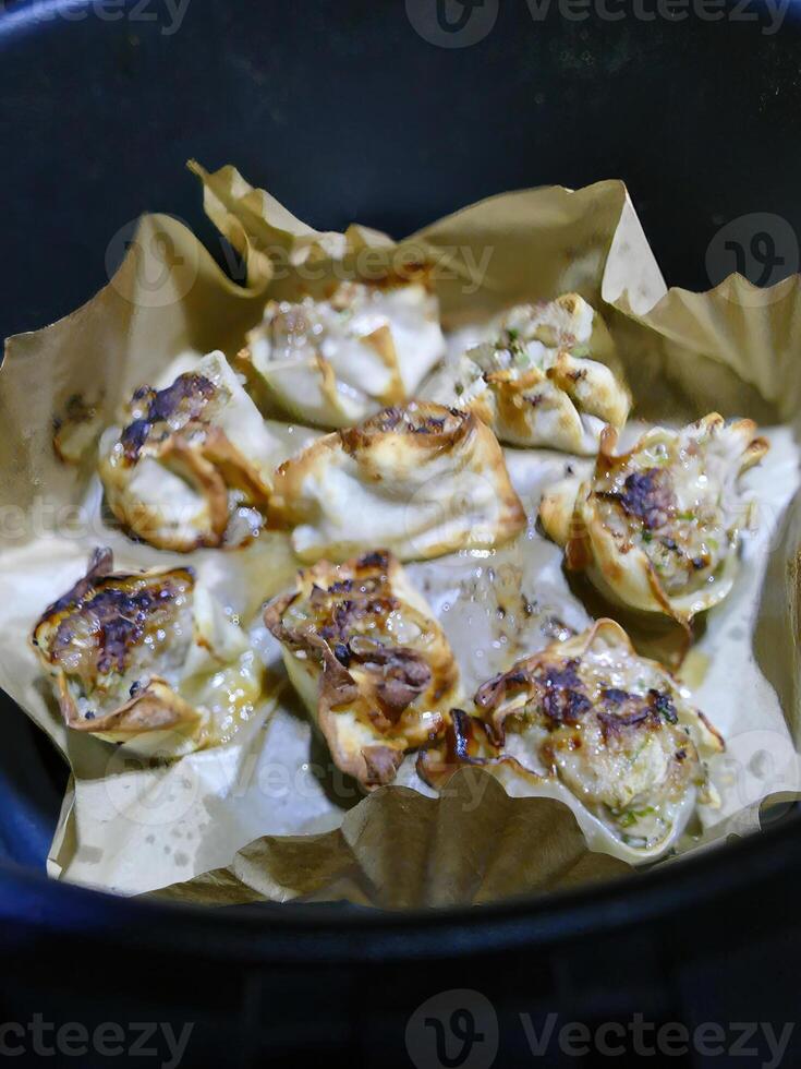 Crisping dim sum shumai in an air fryer photo