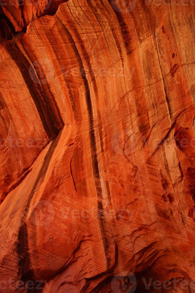 Detail patterns and cracks in Red Navajo sandstone walls photo