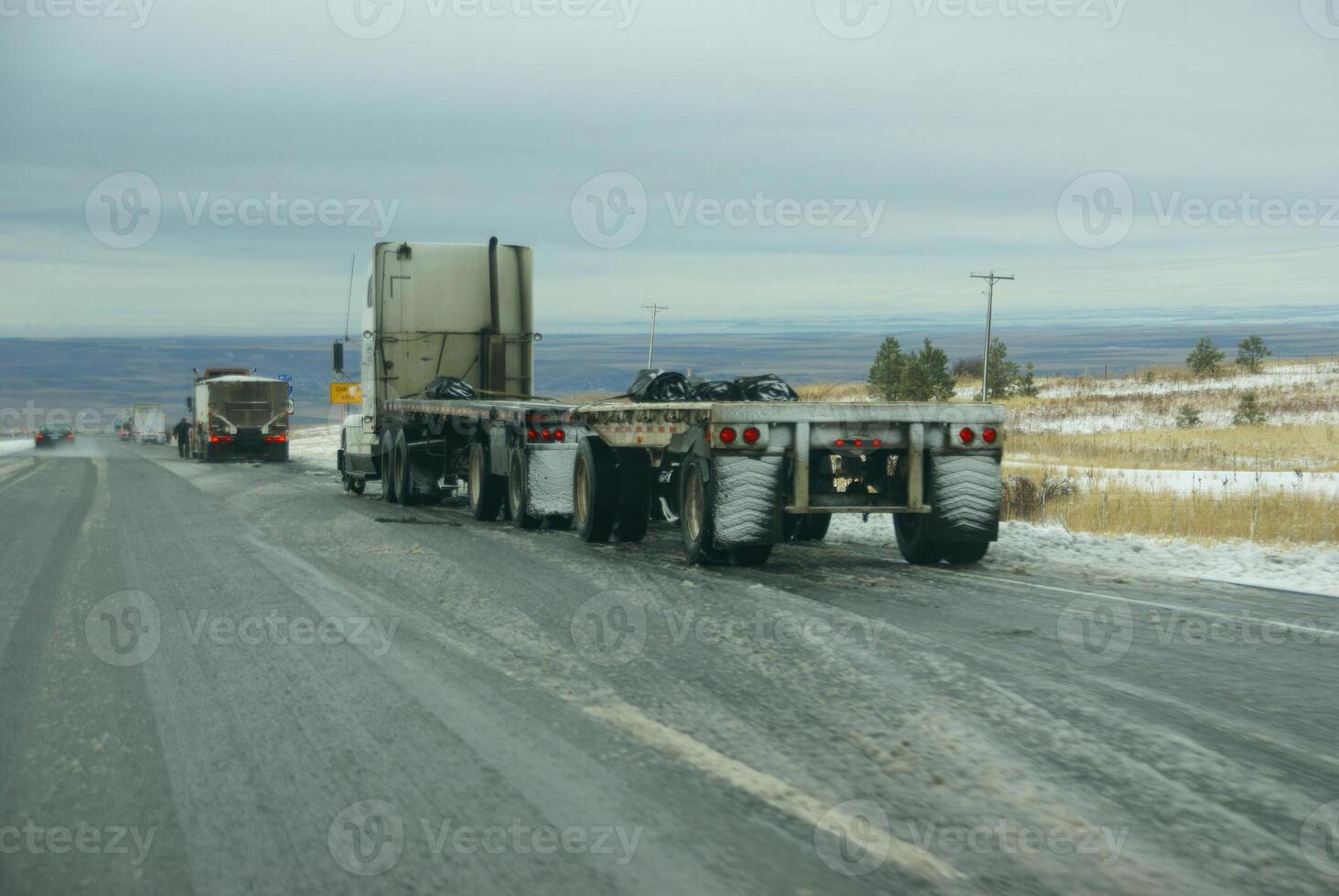 Trucks stop to remove chains photo