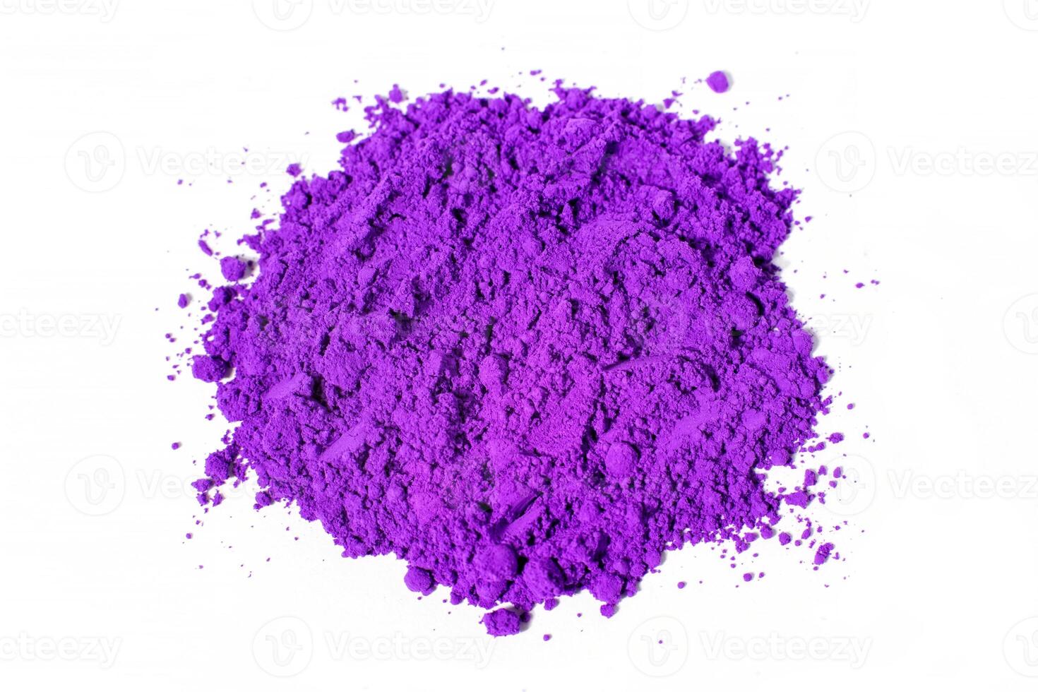 a bunch of dry natural purple pigment on a white background macro photo