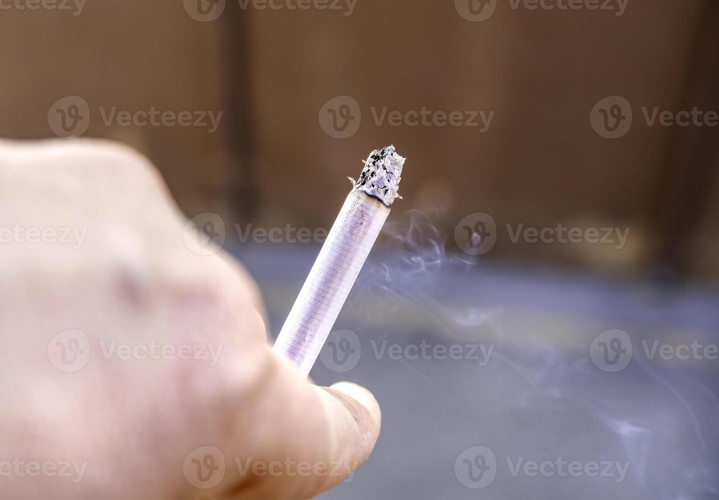 Hand with cigar photo